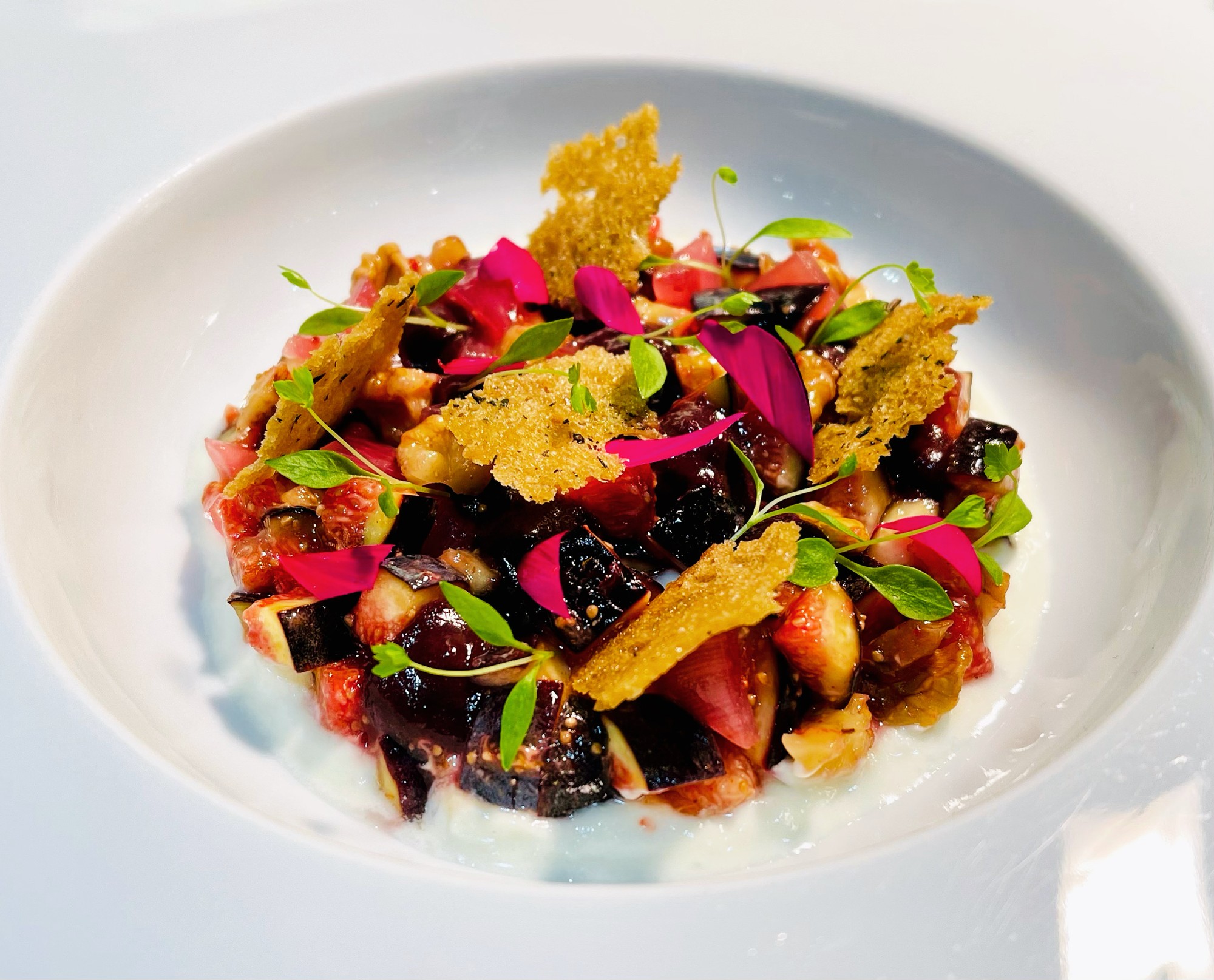 Fig and beetroot tartare with a savoury tuile and edible flowers