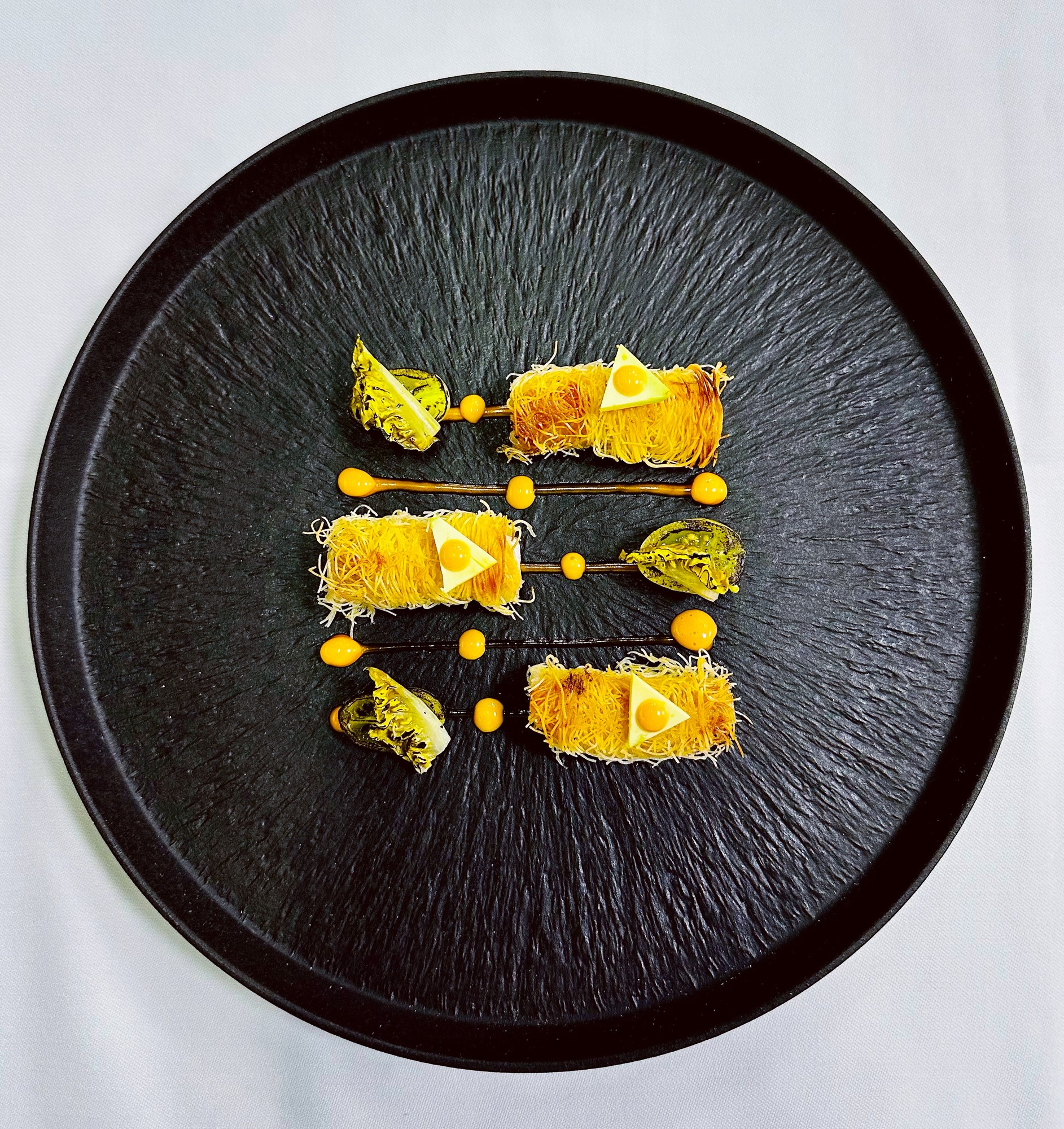 Langoustine wrapped in kataifi pastry with mango and citrus