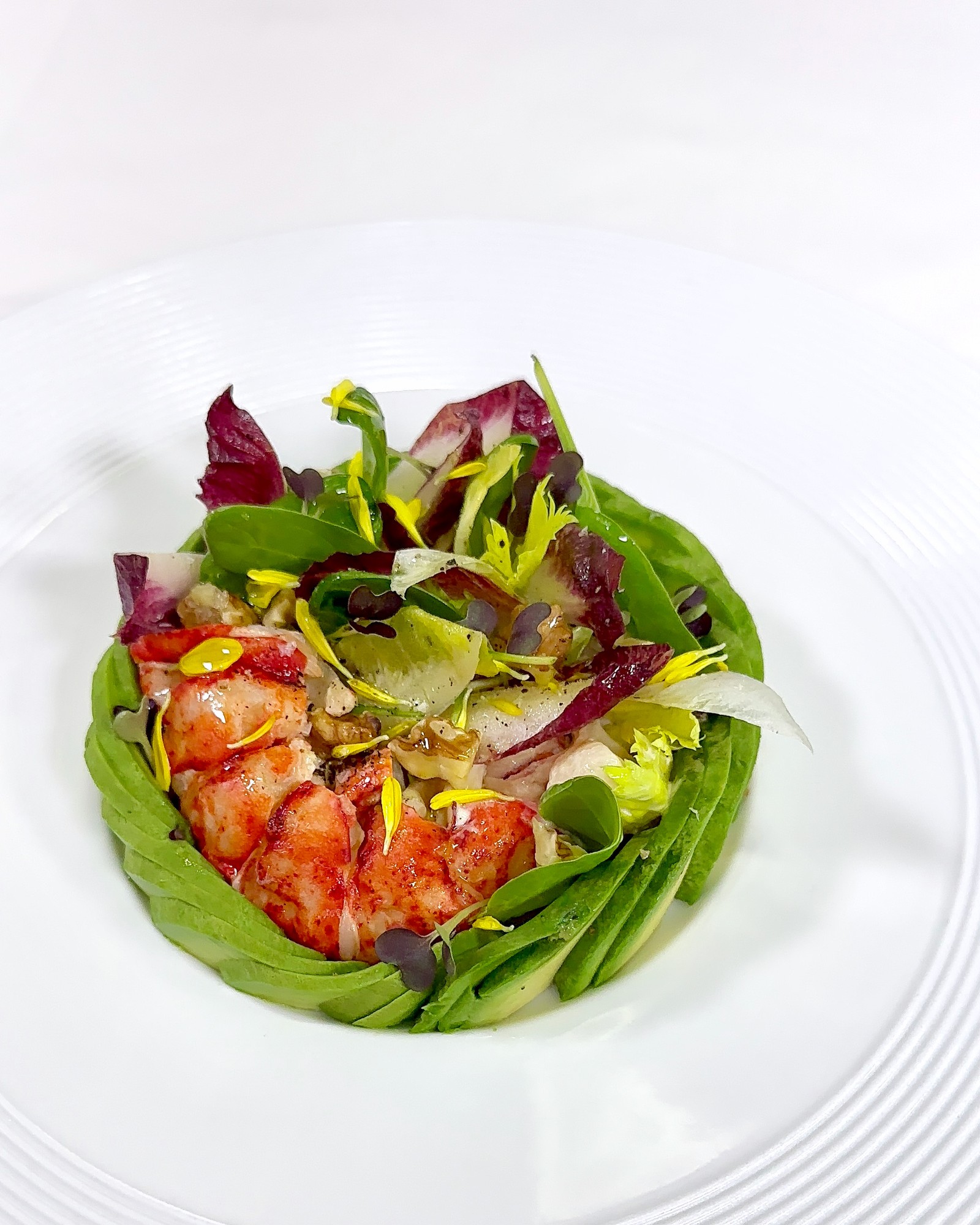 Lobster and avocado salad with mixed greens